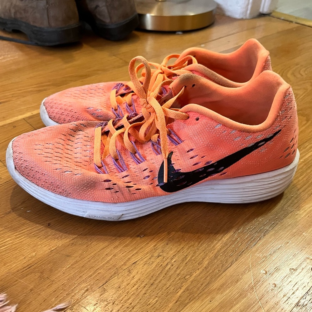 Orange Nike running shoes